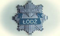 policyjna odznaka z napisem Policja