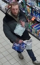 mężczyzna w wieku 30 - 30 lat, wzrost około 175 centymetrów, sylwetka szczupła, włosy ciemne krótkie. Ubrany był w szaro - czarną kurtkę, spodnie typu jeans, białe buty z kolorowymi elementami.